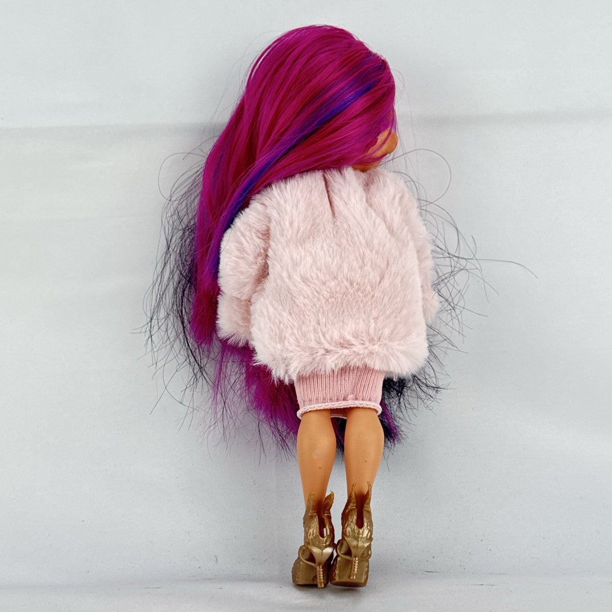 MGA L.O.L. Surprise! OMG Spirit Queen fashion doll with two-tone pink and black hair in a pink faux-fur coat