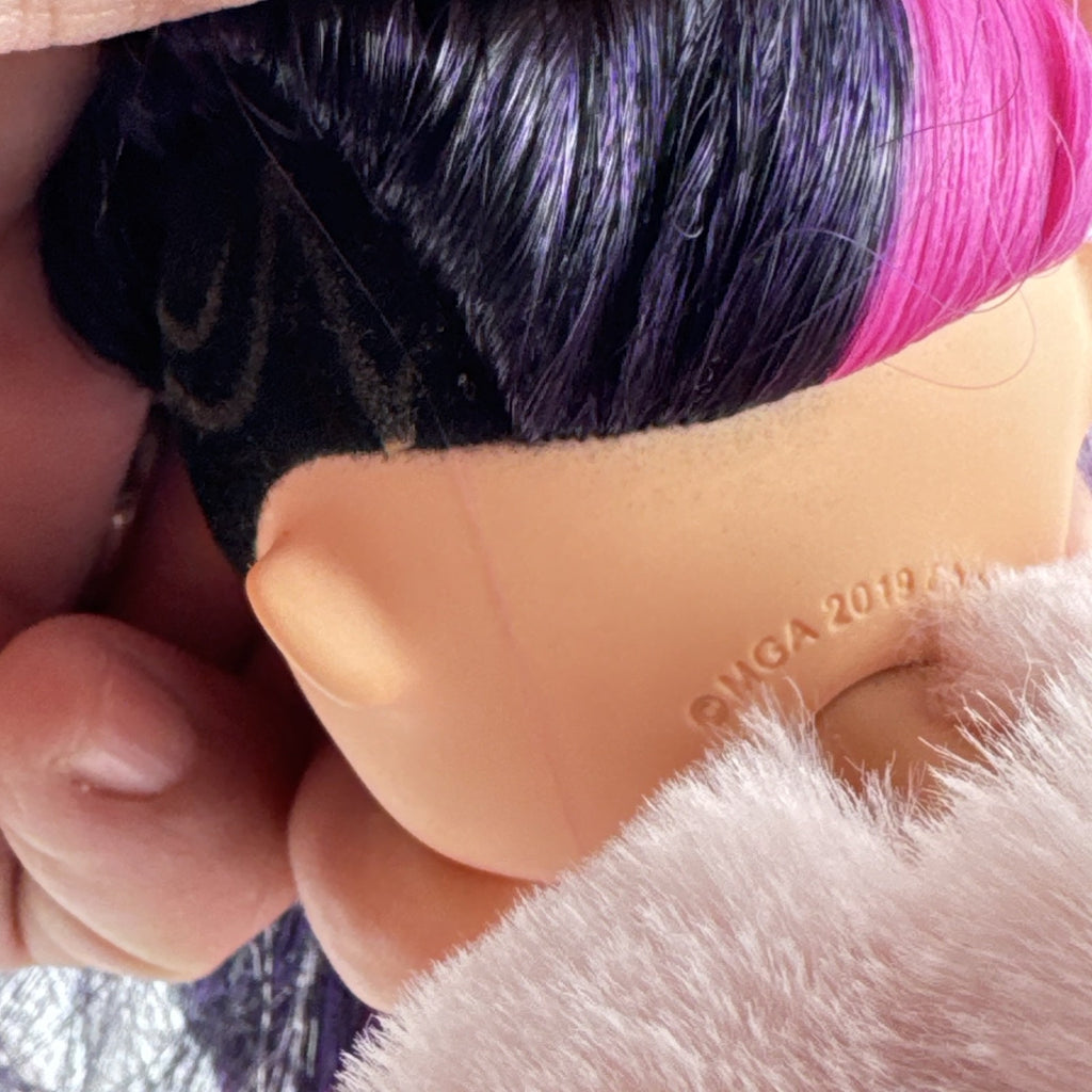 MGA L.O.L. Surprise! OMG Spirit Queen fashion doll with two-tone pink and black hair in a pink faux-fur coat