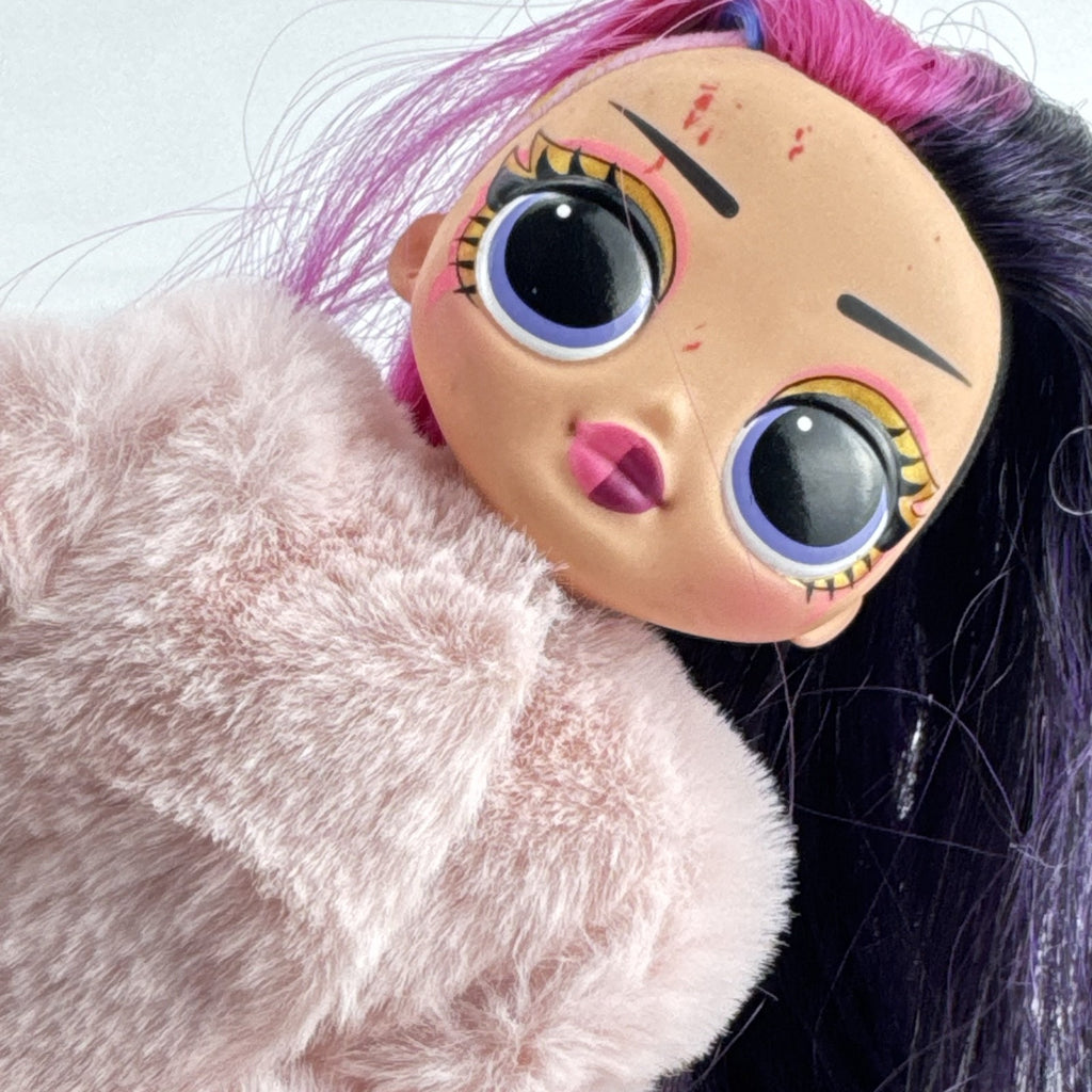 MGA L.O.L. Surprise! OMG Spirit Queen fashion doll with two-tone pink and black hair in a pink faux-fur coat