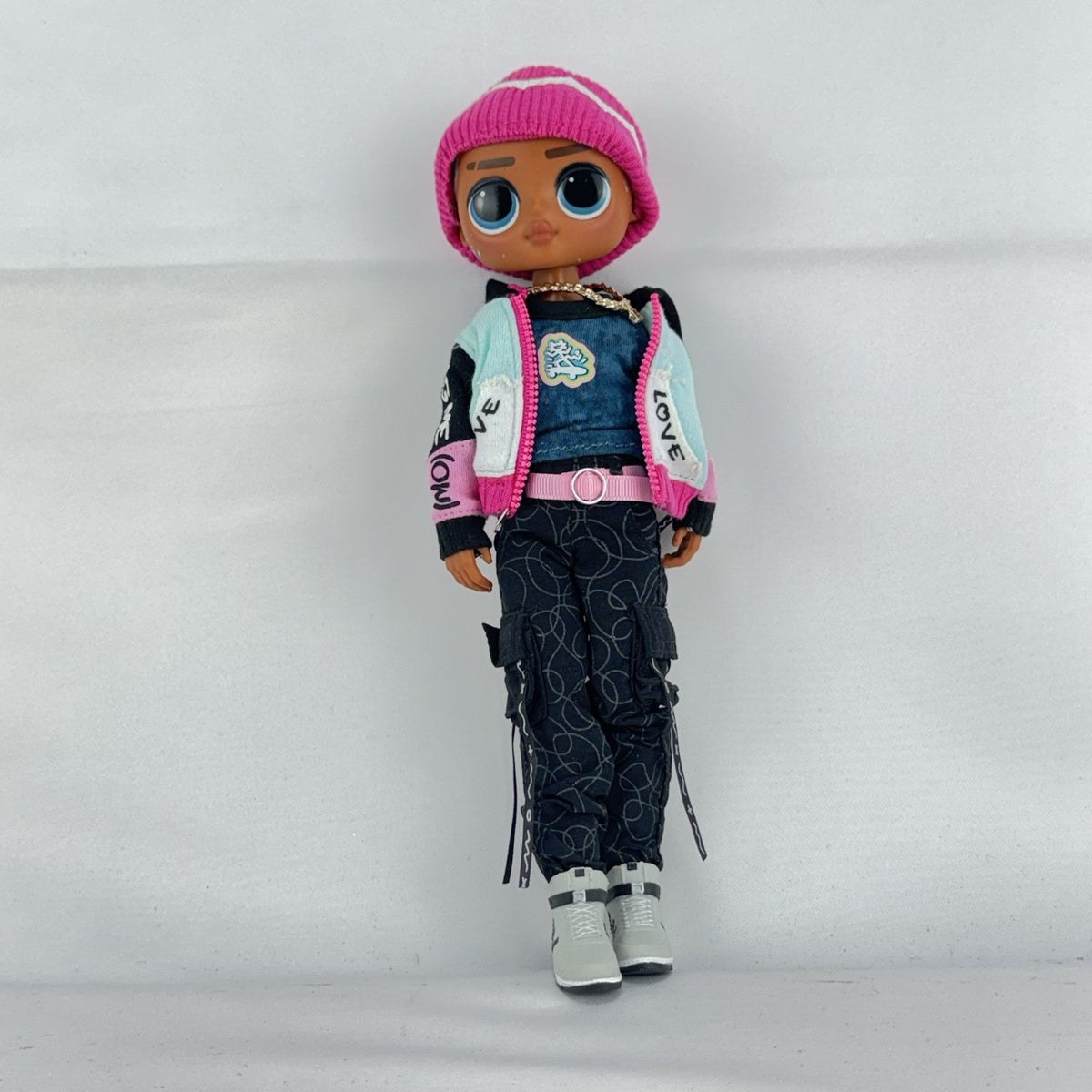 MGA L.O.L. Surprise! O.M.G. Guys Cool Lev 10-inch articulated boy fashion doll in layered streetwear and knit beanie
