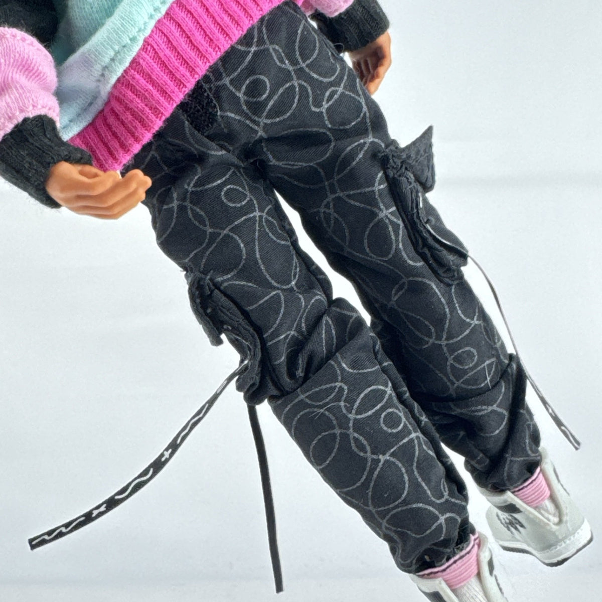 MGA L.O.L. Surprise! O.M.G. Guys Cool Lev 10-inch articulated boy fashion doll in layered streetwear and knit beanie