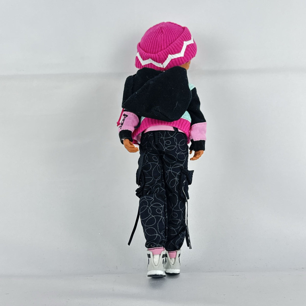 MGA L.O.L. Surprise! O.M.G. Guys Cool Lev 10-inch articulated boy fashion doll in layered streetwear and knit beanie