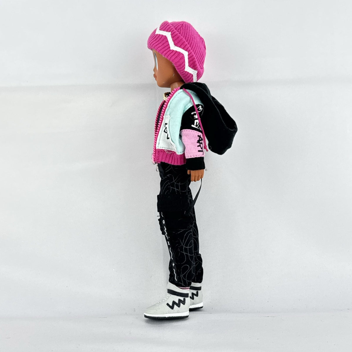 MGA L.O.L. Surprise! O.M.G. Guys Cool Lev 10-inch articulated boy fashion doll in layered streetwear and knit beanie