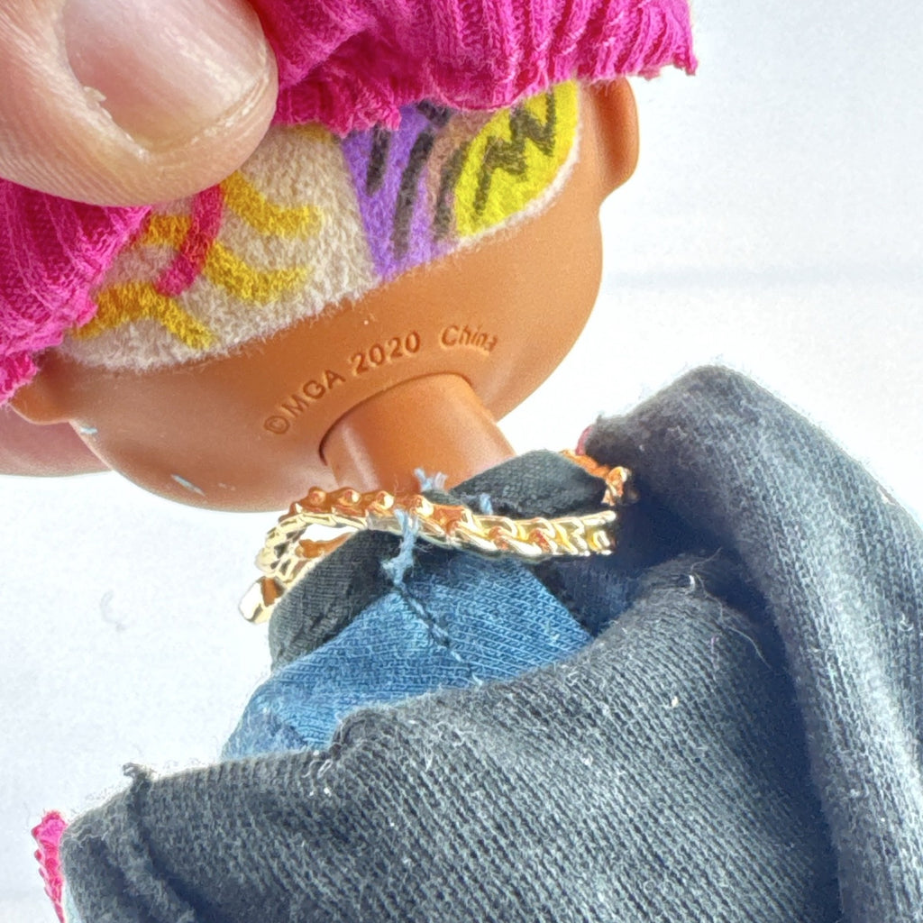 MGA L.O.L. Surprise! O.M.G. Guys Cool Lev 10-inch articulated boy fashion doll in layered streetwear and knit beanie