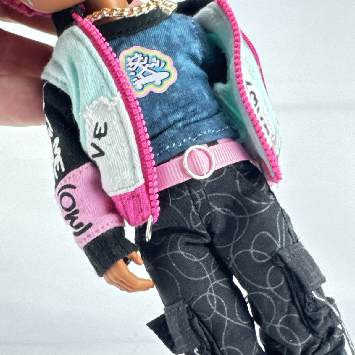 MGA L.O.L. Surprise! O.M.G. Guys Cool Lev 10-inch articulated boy fashion doll in layered streetwear and knit beanie