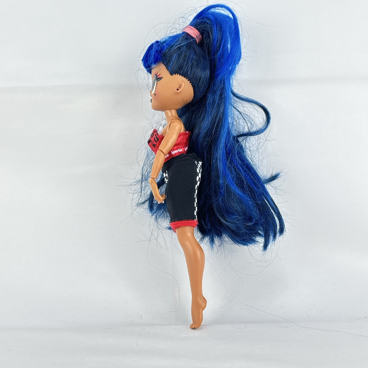 MGA L.O.L. Surprise! O.M.G. Downtown B.B. fashion doll with high blue ponytail and checkered shorts