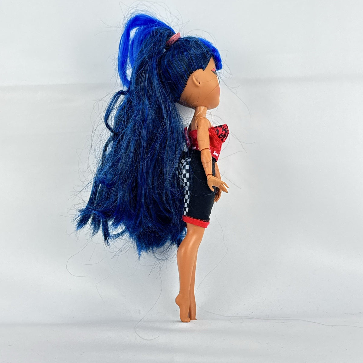 MGA L.O.L. Surprise! O.M.G. Downtown B.B. fashion doll with high blue ponytail and checkered shorts
