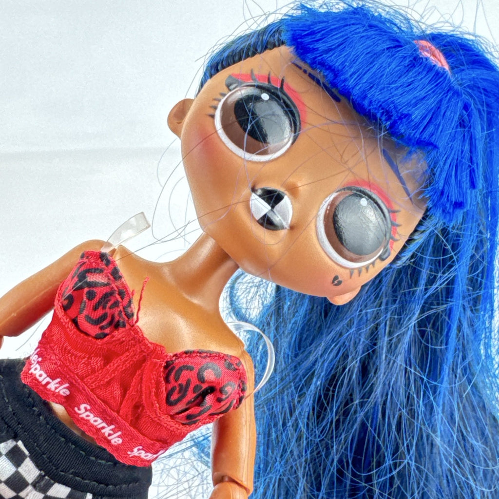 MGA L.O.L. Surprise! O.M.G. Downtown B.B. fashion doll with high blue ponytail and checkered shorts