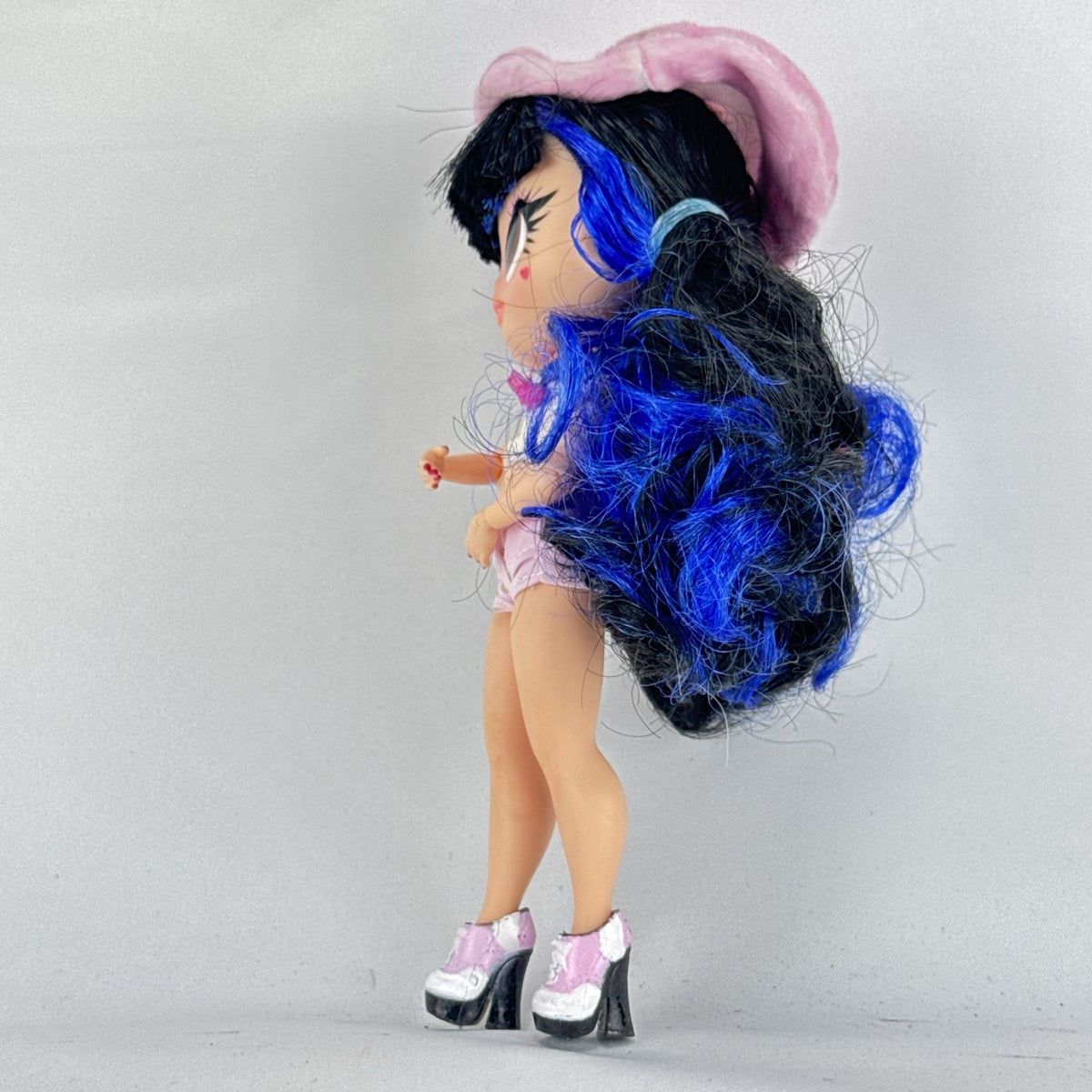 MGA L.O.L. Surprise Tweens Series 2 Aya Cherry fashion doll with blue hair, beret, and backpack