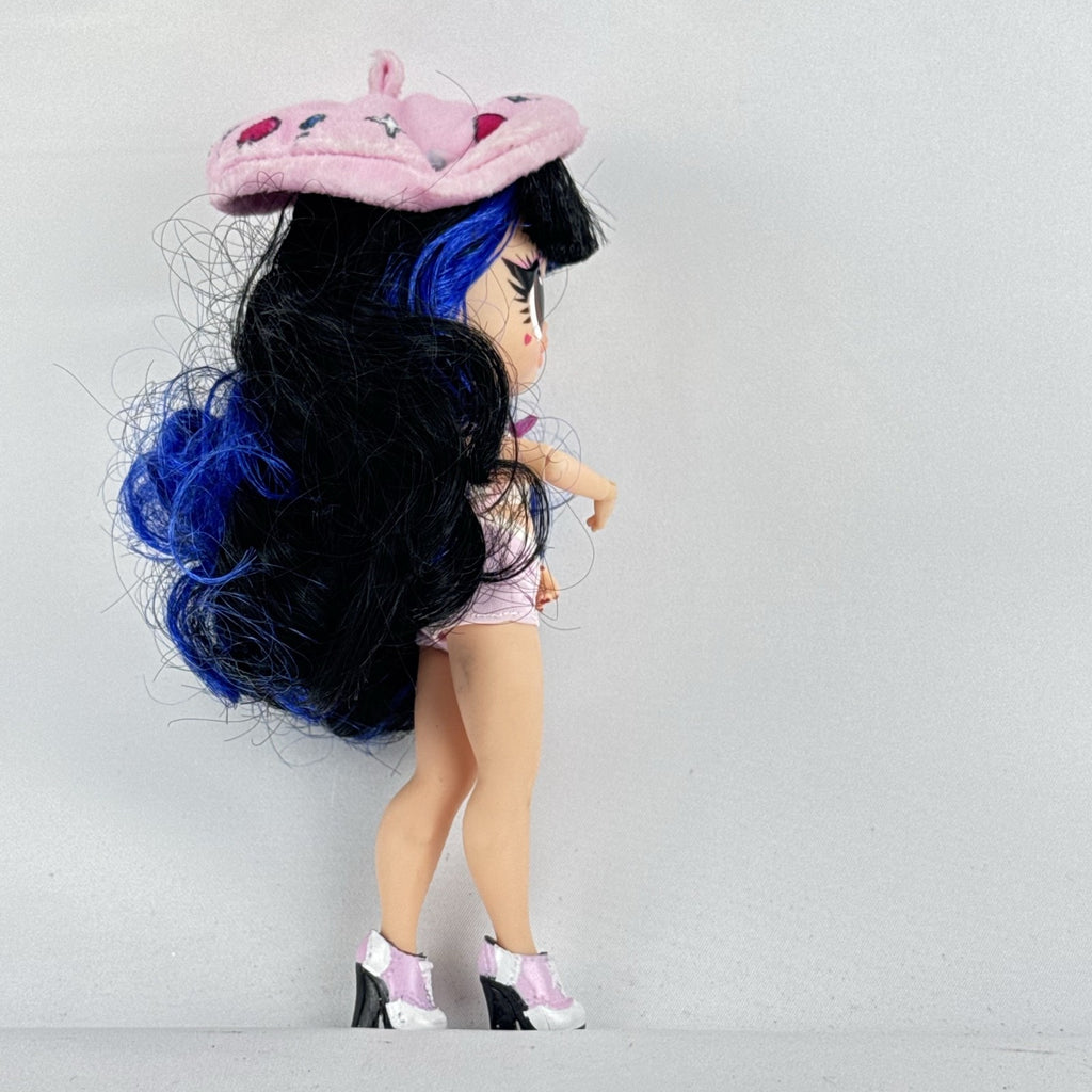 MGA L.O.L. Surprise Tweens Series 2 Aya Cherry fashion doll with blue hair, beret, and backpack