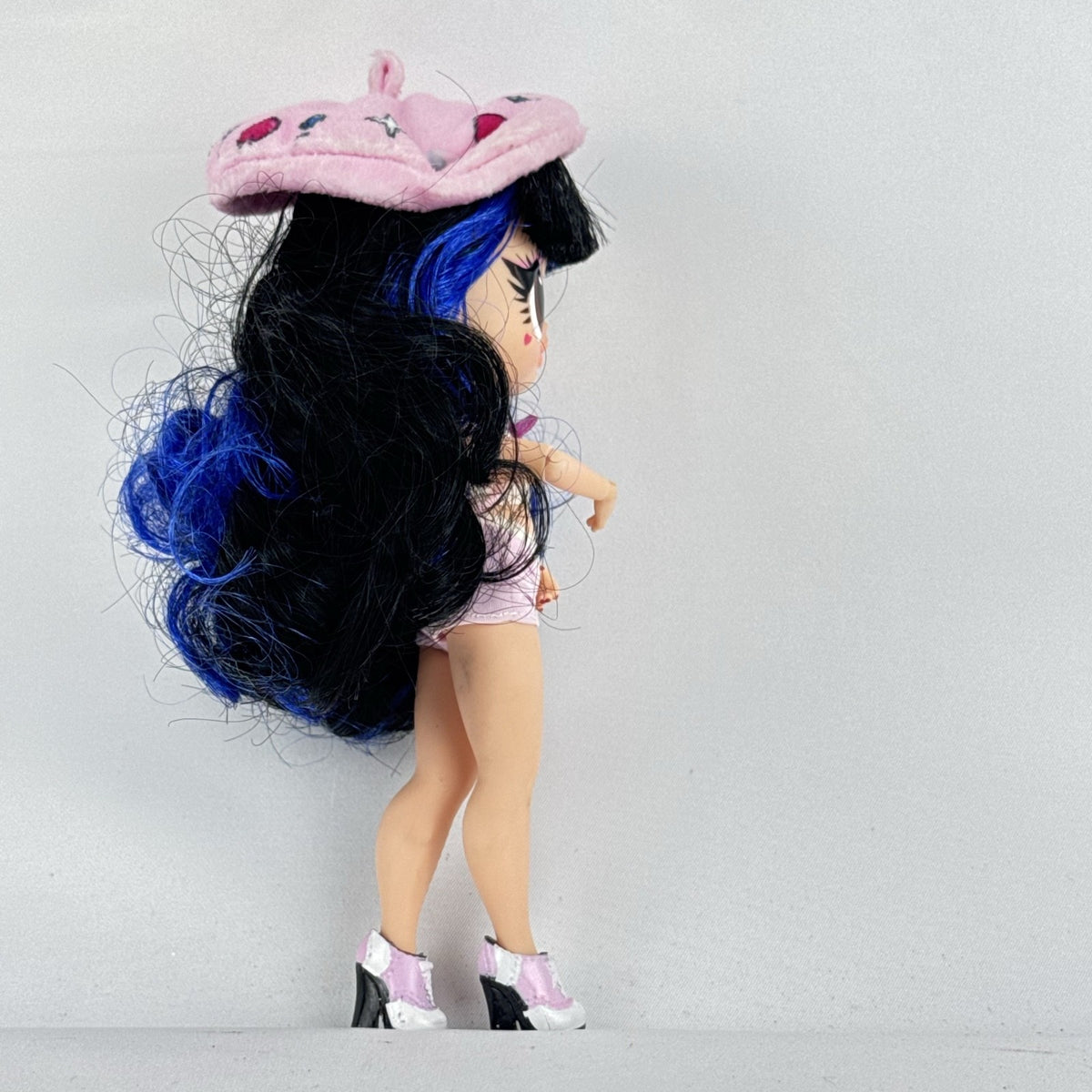 MGA L.O.L. Surprise Tweens Series 2 Aya Cherry fashion doll with blue hair, beret, and backpack