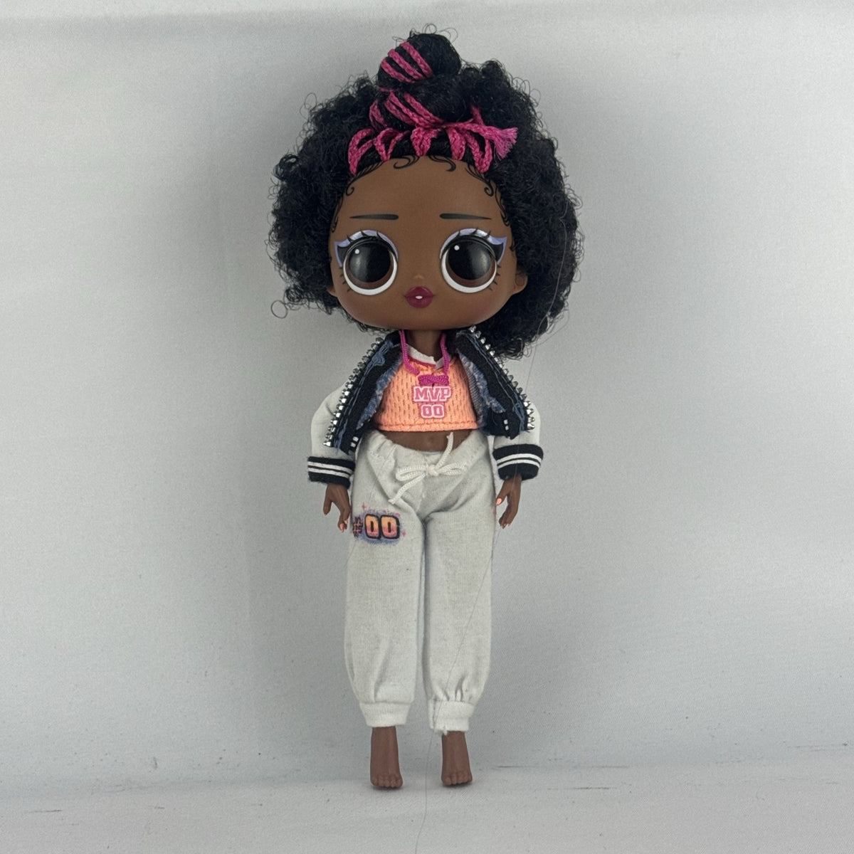 MGA Entertainment L.O.L. Surprise! Tweens Hoops Cutie fashion doll wearing varsity jacket and MVP athletic outfit