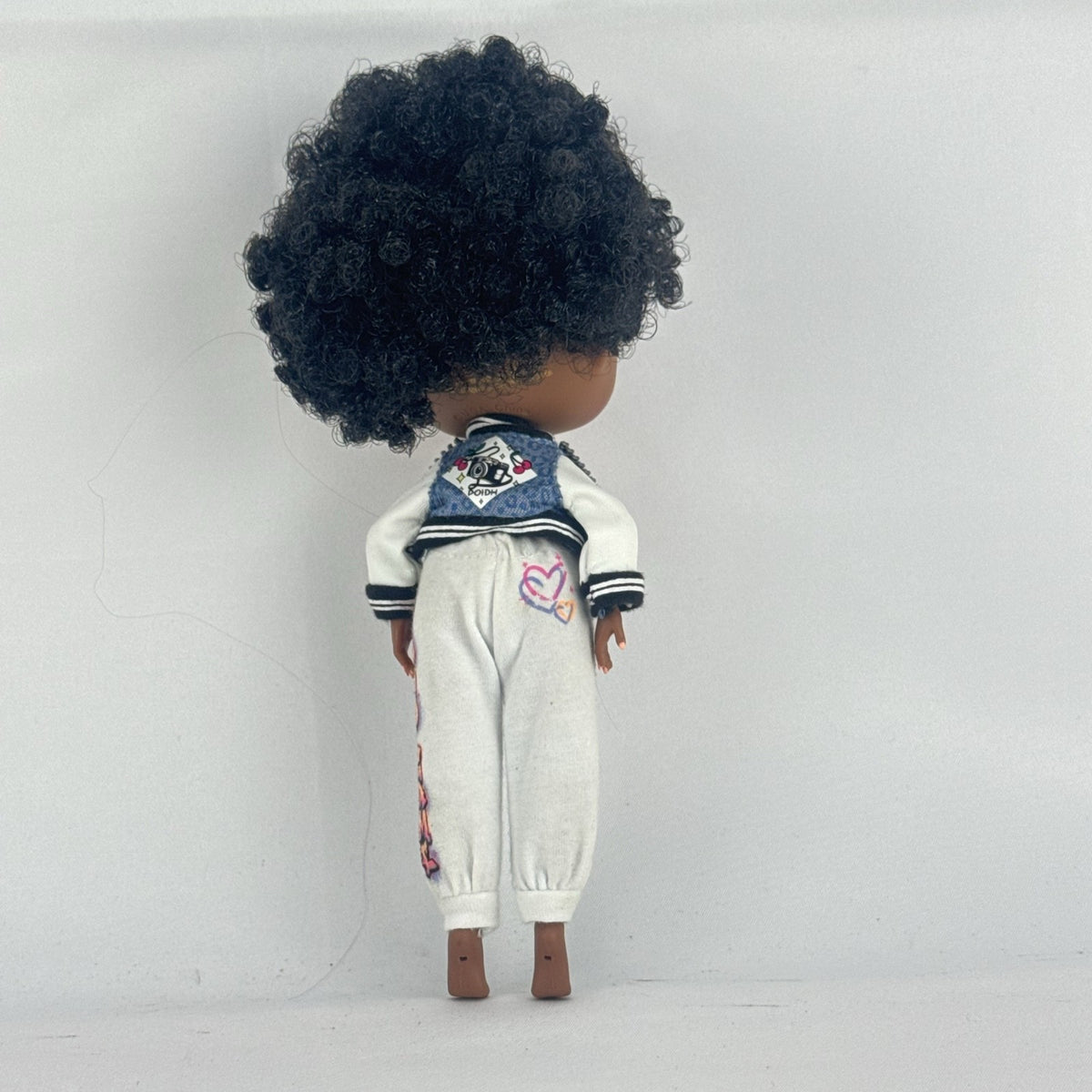 MGA Entertainment L.O.L. Surprise! Tweens Hoops Cutie fashion doll wearing varsity jacket and MVP athletic outfit