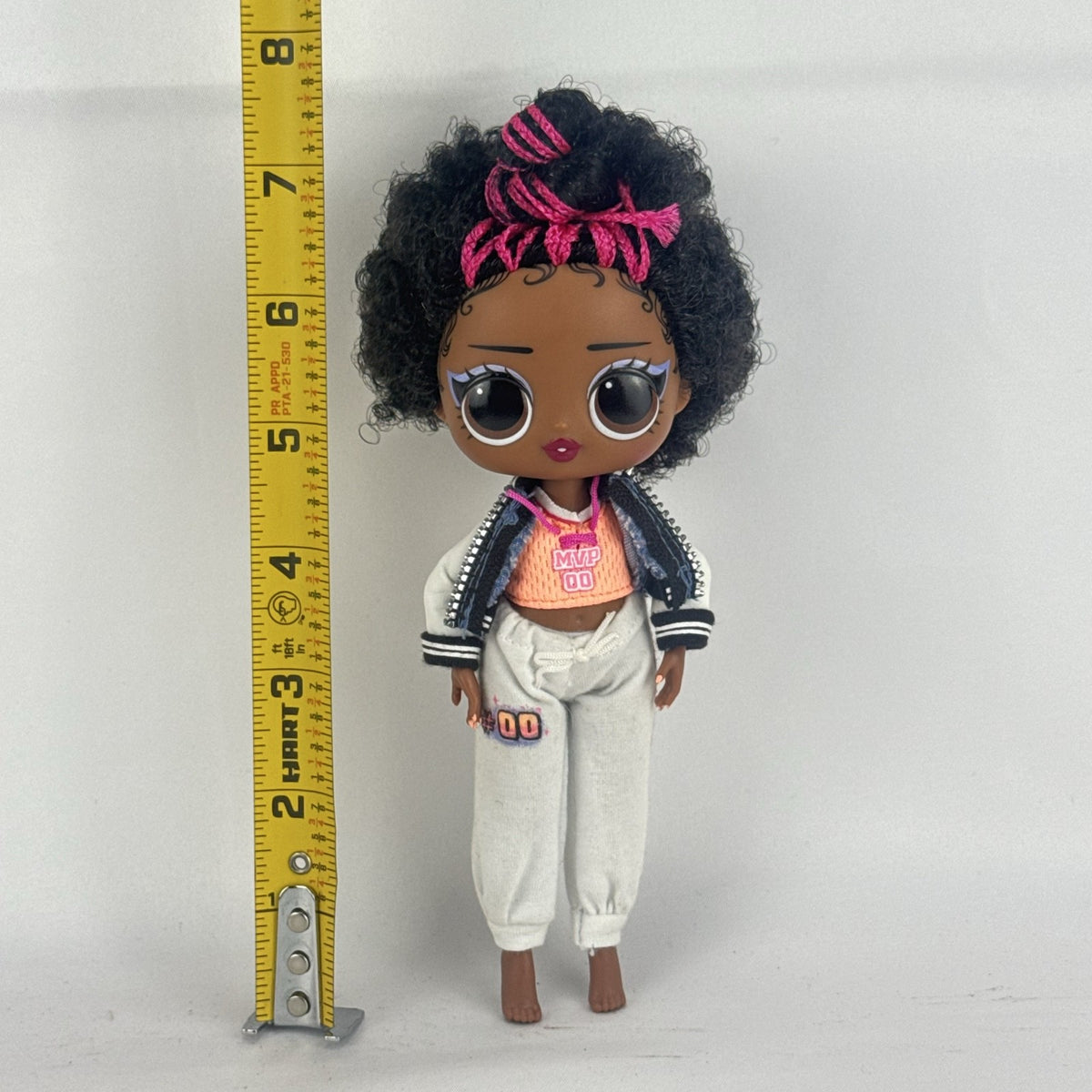 MGA Entertainment L.O.L. Surprise! Tweens Hoops Cutie fashion doll wearing varsity jacket and MVP athletic outfit
