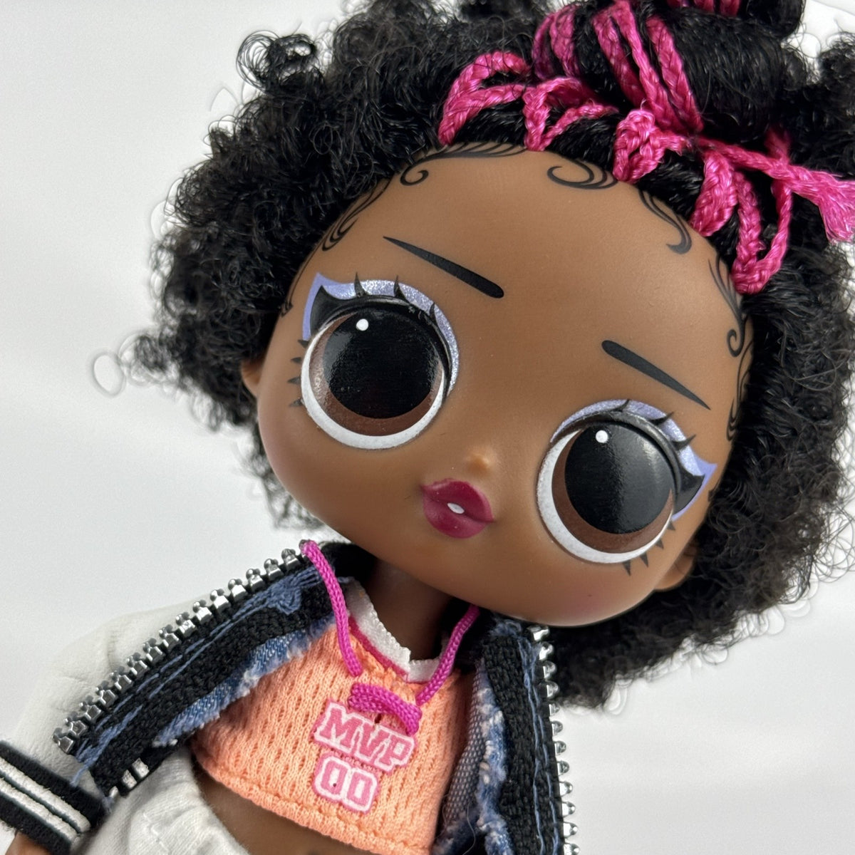 MGA Entertainment L.O.L. Surprise! Tweens Hoops Cutie fashion doll wearing varsity jacket and MVP athletic outfit