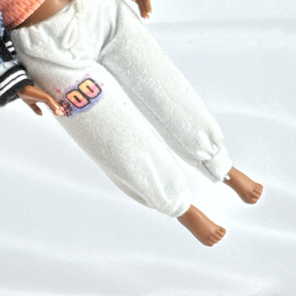 MGA Entertainment L.O.L. Surprise! Tweens Hoops Cutie fashion doll wearing varsity jacket and MVP athletic outfit