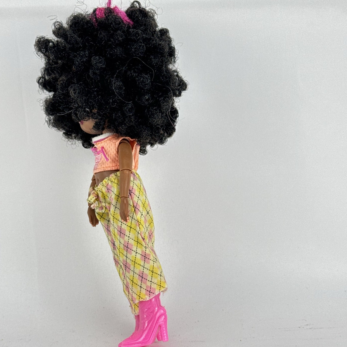 MGA Entertainment L.O.L. Surprise! Tweens Hoops Cutie 6-inch doll in argyle pants and pink boots with textured afro