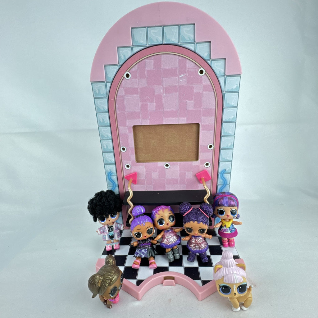 MGA L.O.L. Surprise stage playset featuring a pink arched backdrop, checkered floor, five mini dolls, and two pets