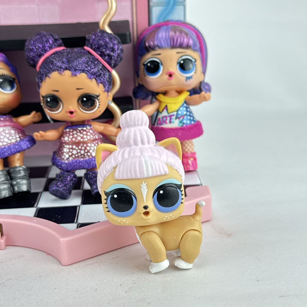 MGA L.O.L. Surprise stage playset featuring a pink arched backdrop, checkered floor, five mini dolls, and two pets
