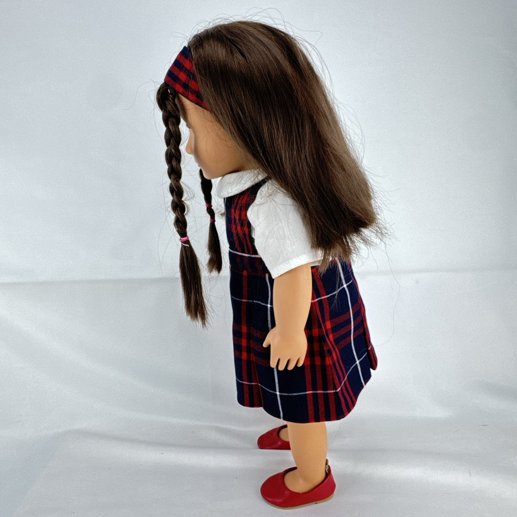 Battat Our Generation 18-inch doll with brown hair and eyes in red and navy plaid school uniform dress and red shoes