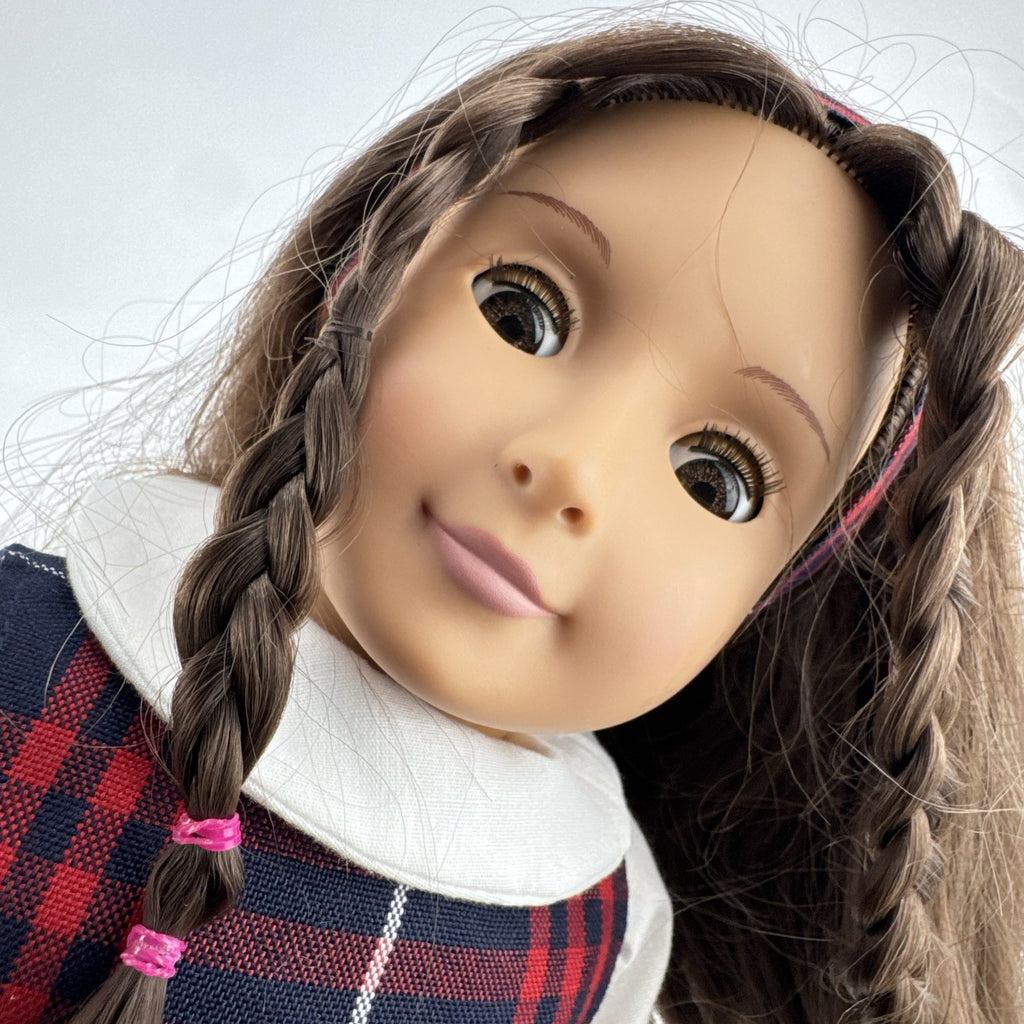 Battat Our Generation 18-inch doll with brown hair and eyes in red and navy plaid school uniform dress and red shoes