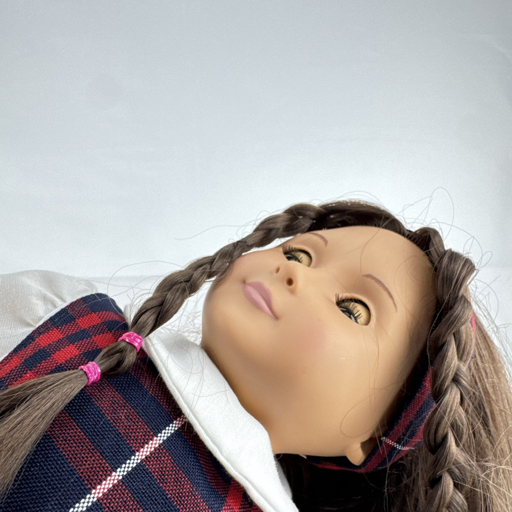 Battat Our Generation 18-inch doll with brown hair and eyes in red and navy plaid school uniform dress and red shoes