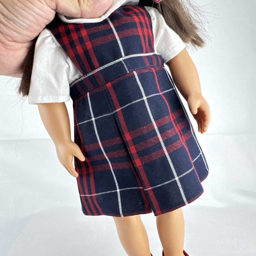 Battat Our Generation 18-inch doll with brown hair and eyes in red and navy plaid school uniform dress and red shoes