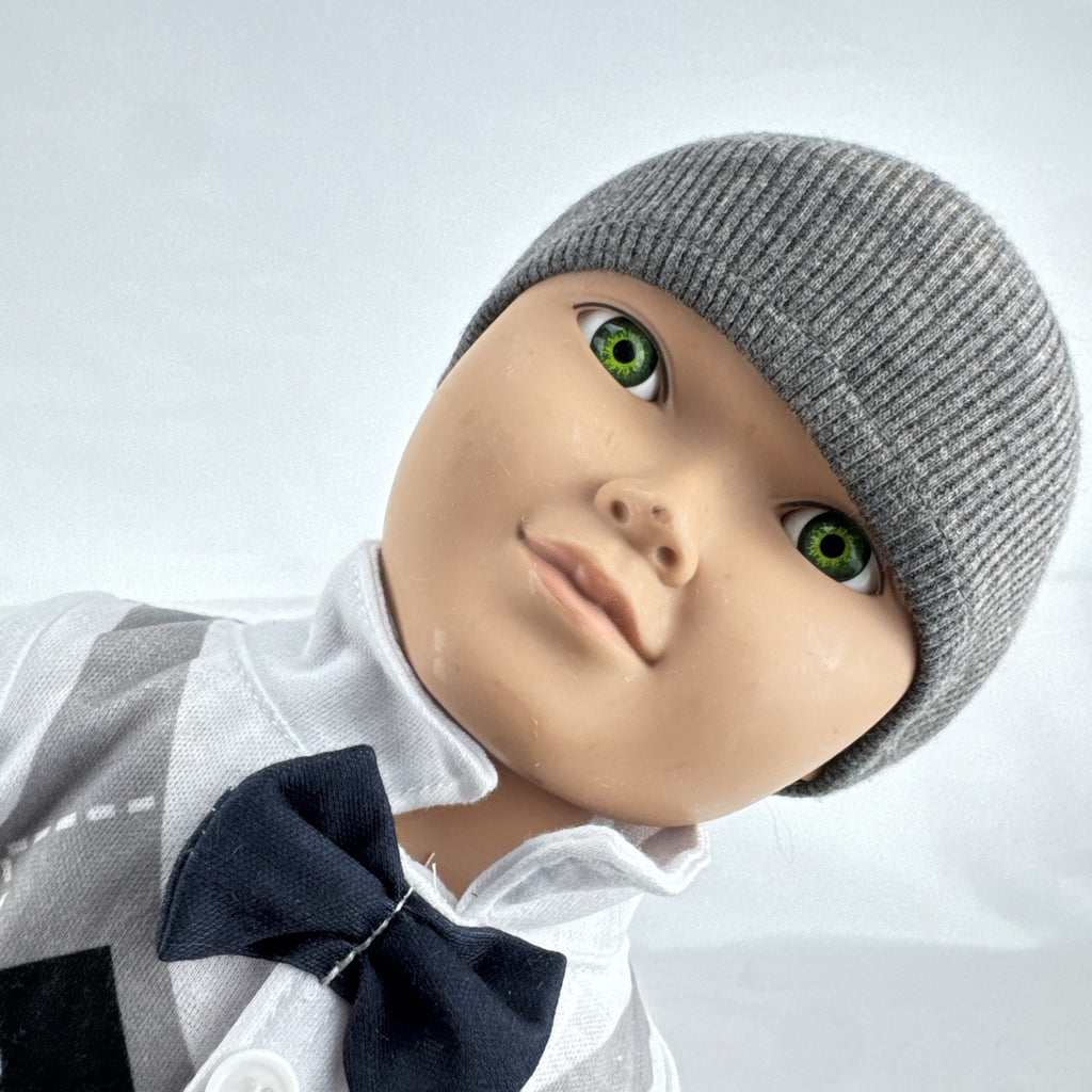 Cititoy 18-inch boy doll with green eyes wearing a knit beanie and argyle vest outfit