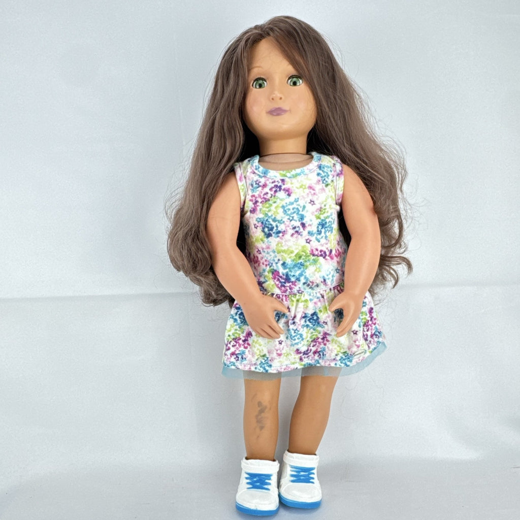 Battat Our Generation 18-inch doll with wavy brown hair, green eyes, and floral dress.