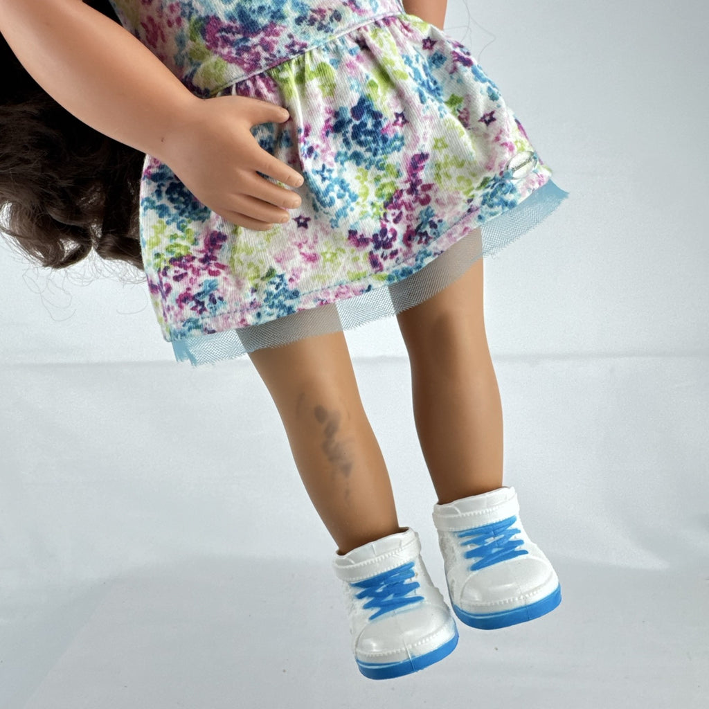 Battat Our Generation 18-inch doll with wavy brown hair, green eyes, and floral dress.