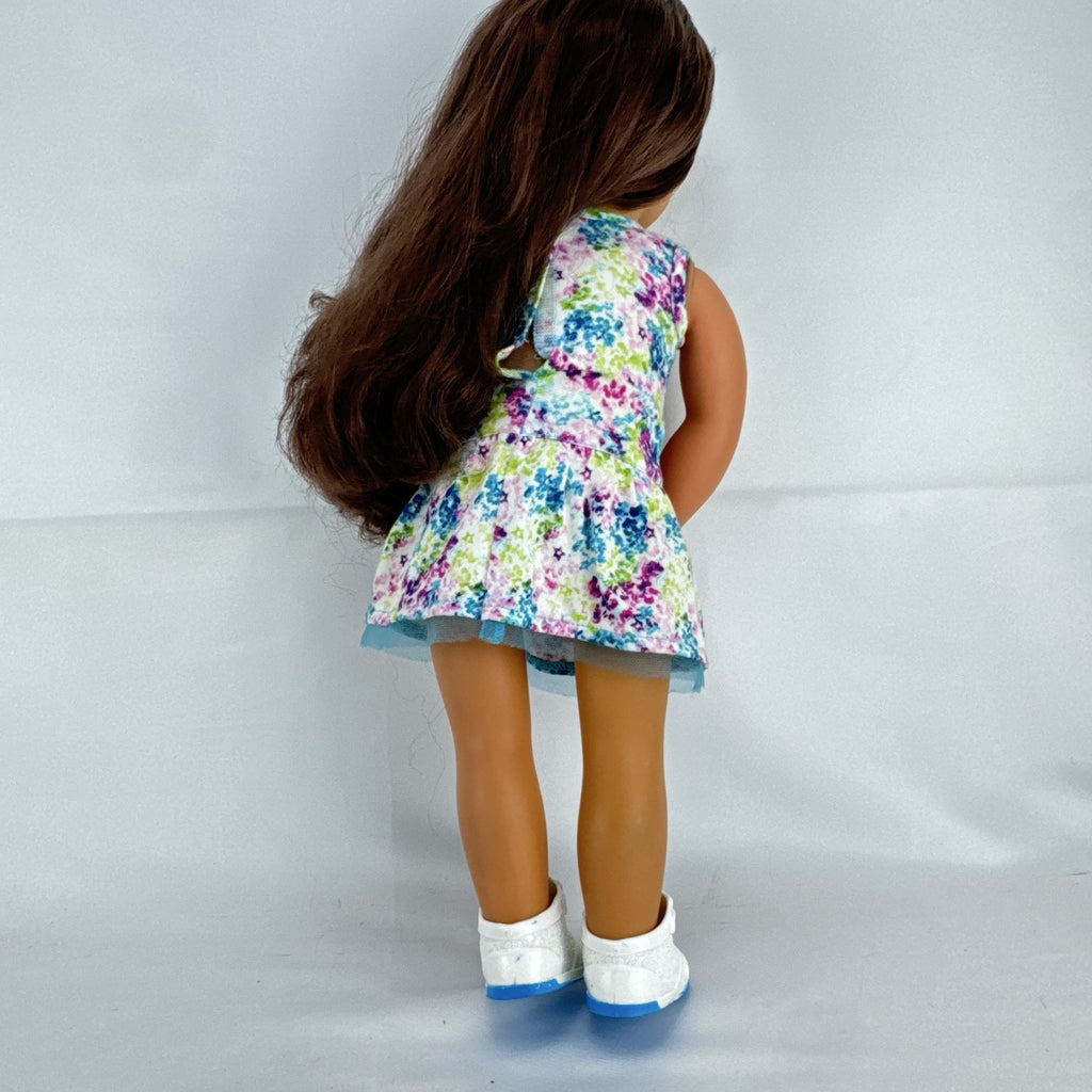 Battat Our Generation 18-inch doll with wavy brown hair, green eyes, and floral dress.