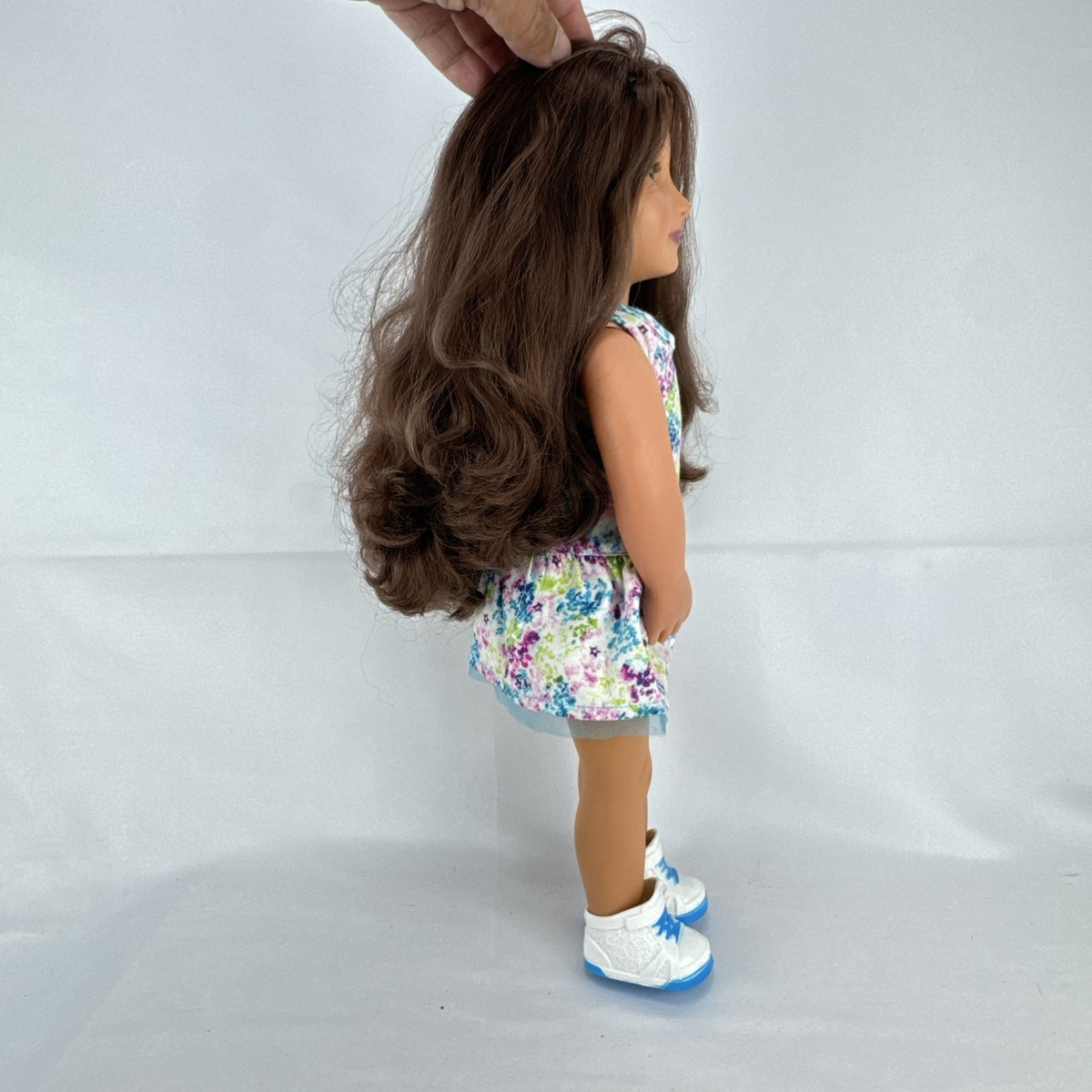 Battat Our Generation 18-inch doll with wavy brown hair, green eyes, and floral dress.