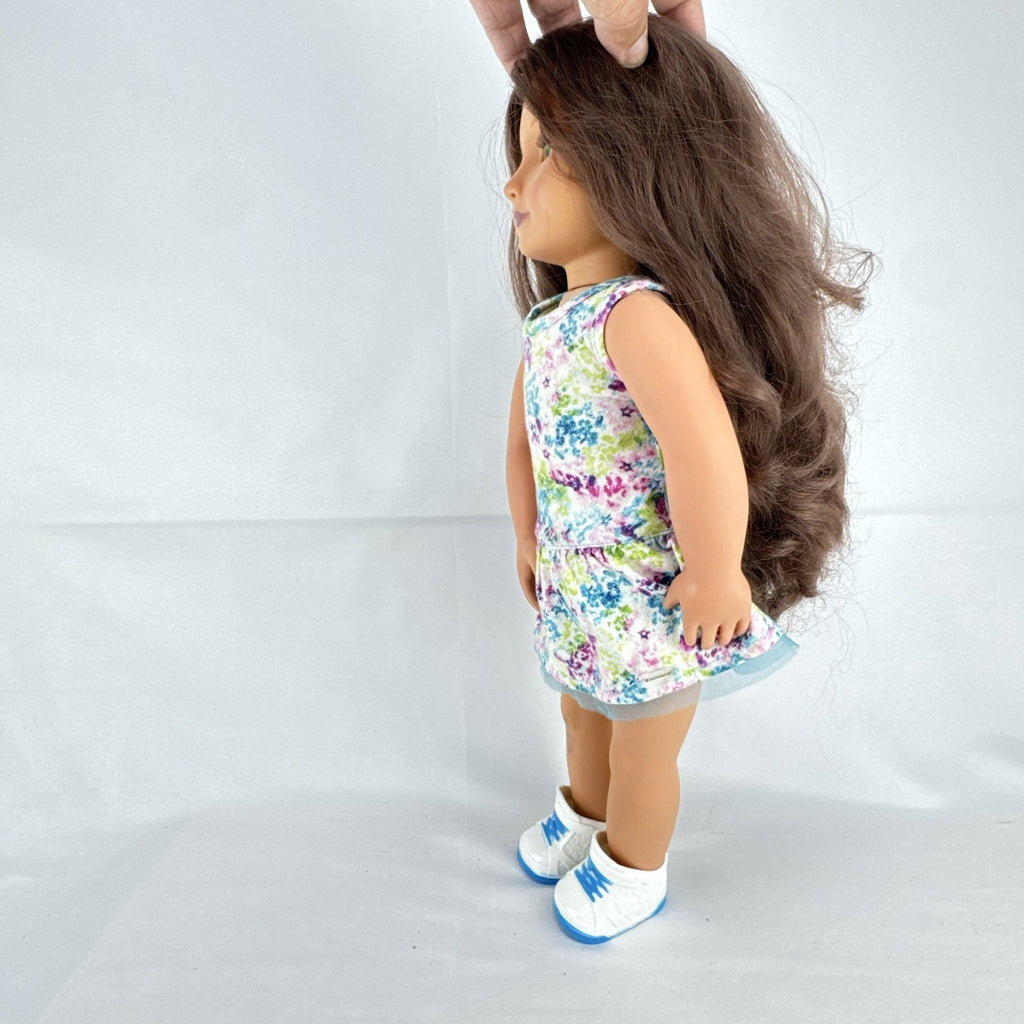 Battat Our Generation 18-inch doll with wavy brown hair, green eyes, and floral dress.