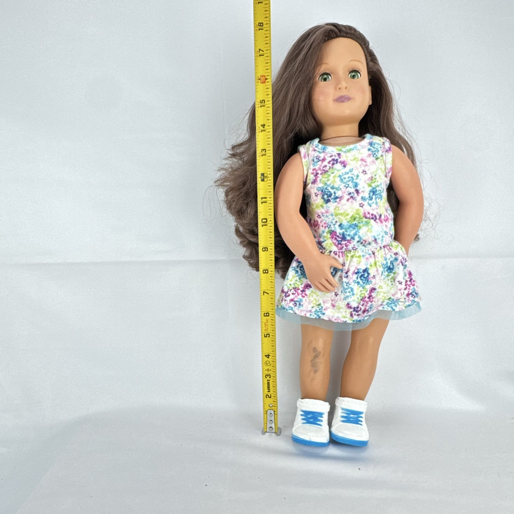 Battat Our Generation 18-inch doll with wavy brown hair, green eyes, and floral dress.