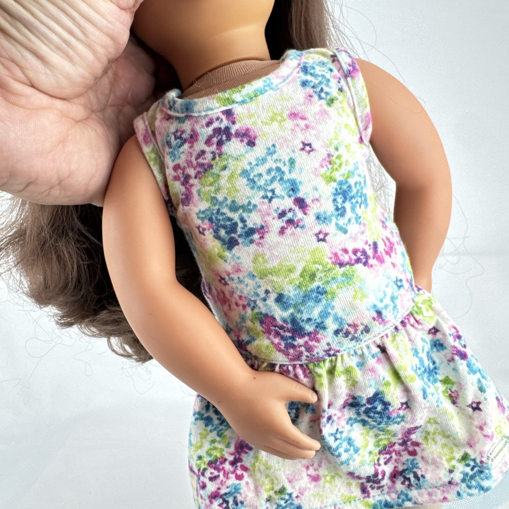 Battat Our Generation 18-inch doll with wavy brown hair, green eyes, and floral dress.