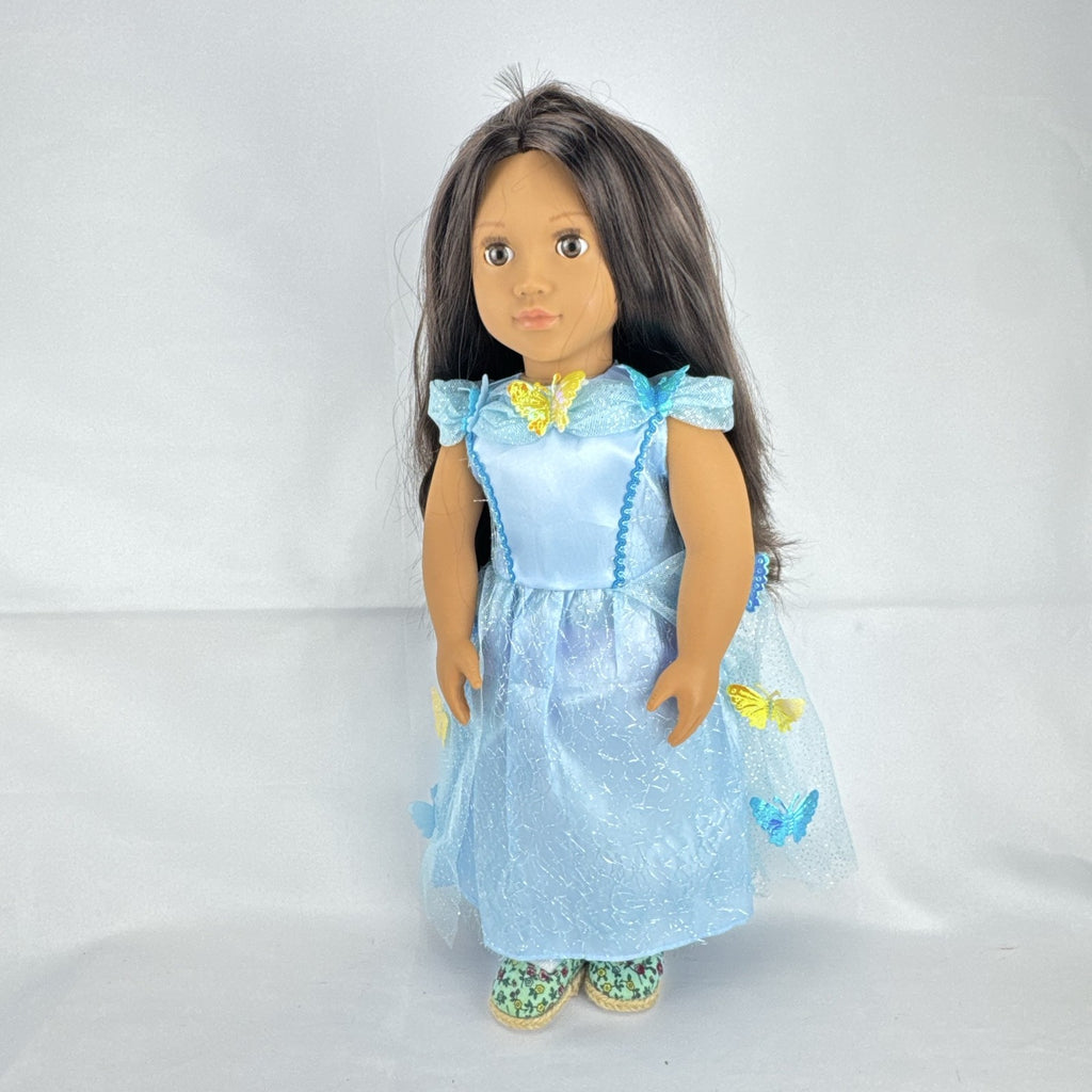 Our Generation 18-inch doll by Battat wearing a light blue butterfly princess dress and patterned shoes