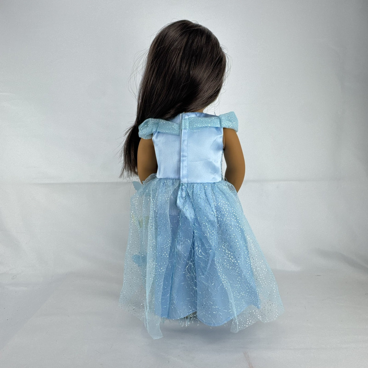 Our Generation 18-inch doll by Battat wearing a light blue butterfly princess dress and patterned shoes