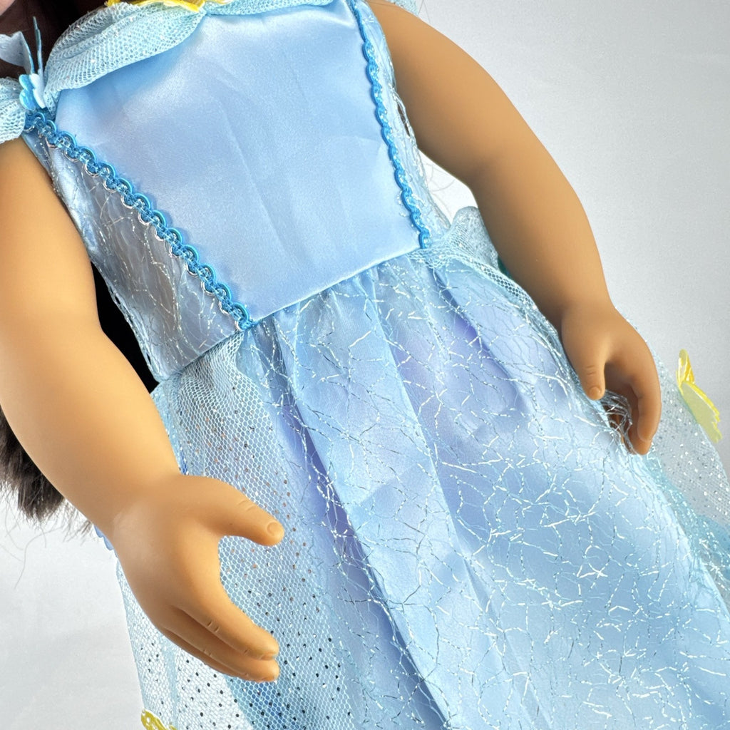Our Generation 18-inch doll by Battat wearing a light blue butterfly princess dress and patterned shoes