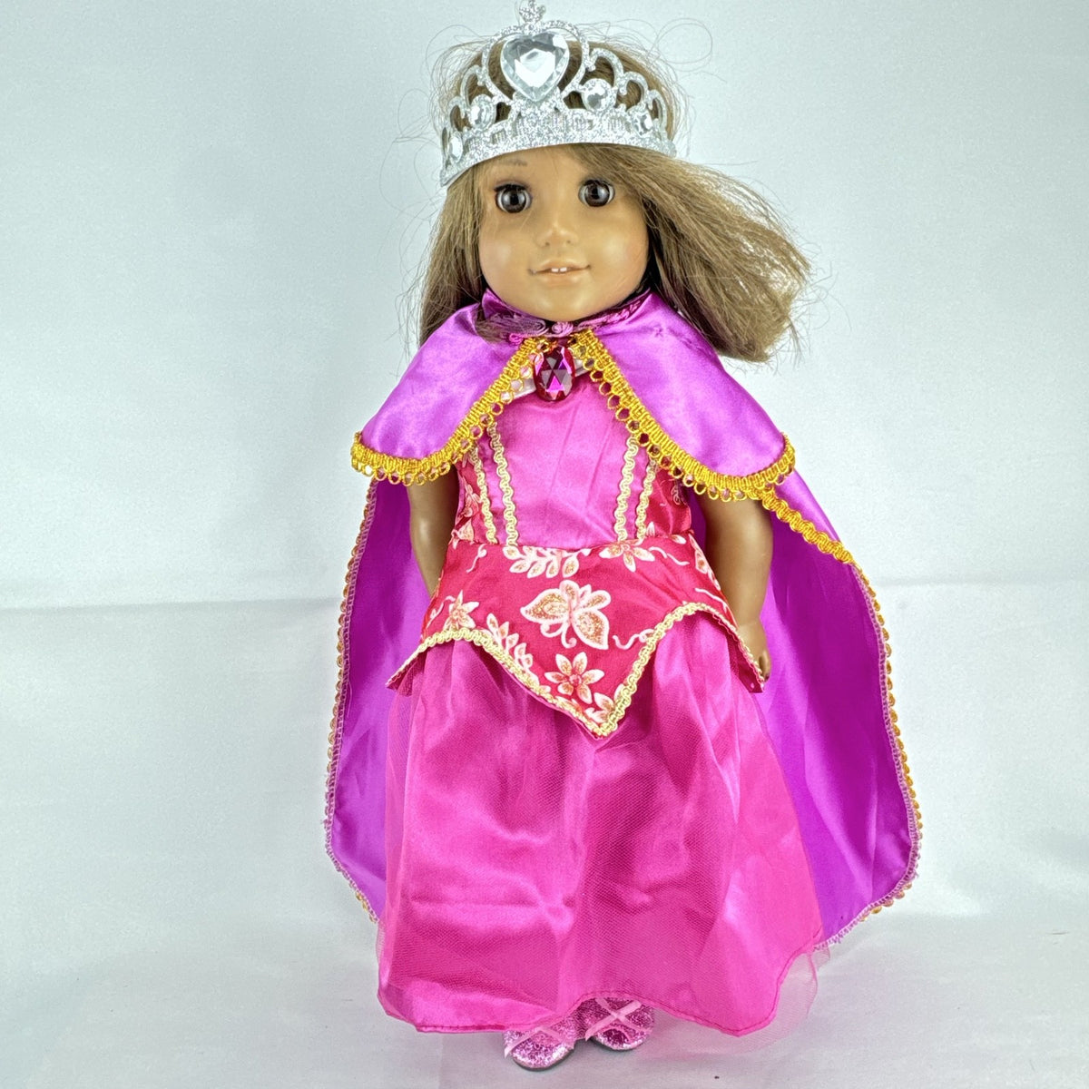 18-inch Pleasant Company American Girl doll with brown hair and brown eyes wearing pink and gold princess outfit