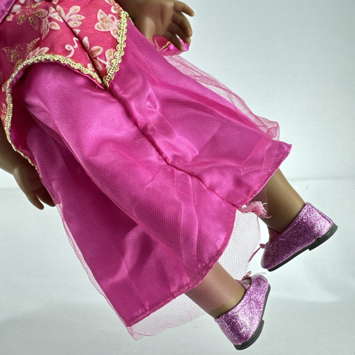 18-inch Pleasant Company American Girl doll with brown hair and brown eyes wearing pink and gold princess outfit