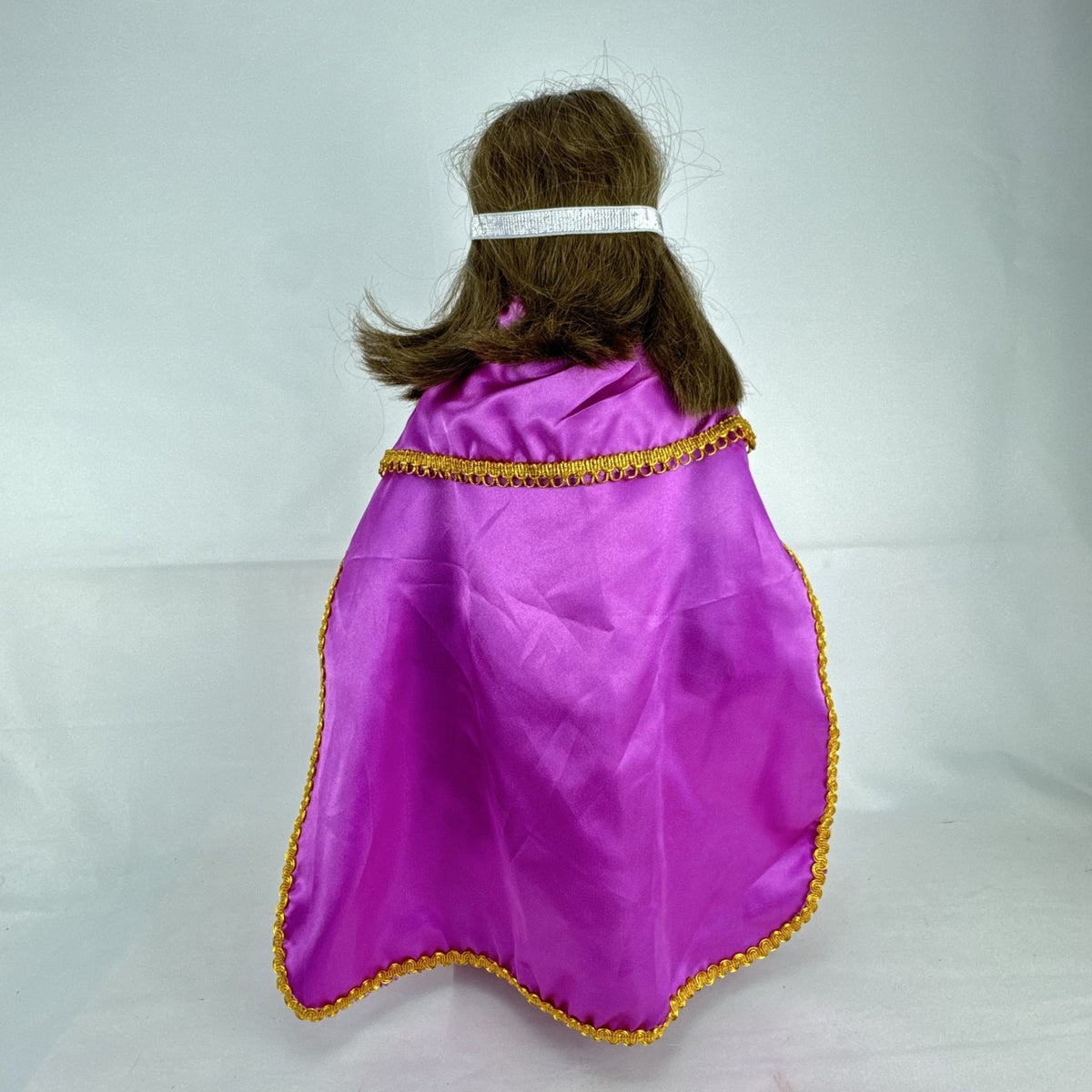 18-inch Pleasant Company American Girl doll with brown hair and brown eyes wearing pink and gold princess outfit