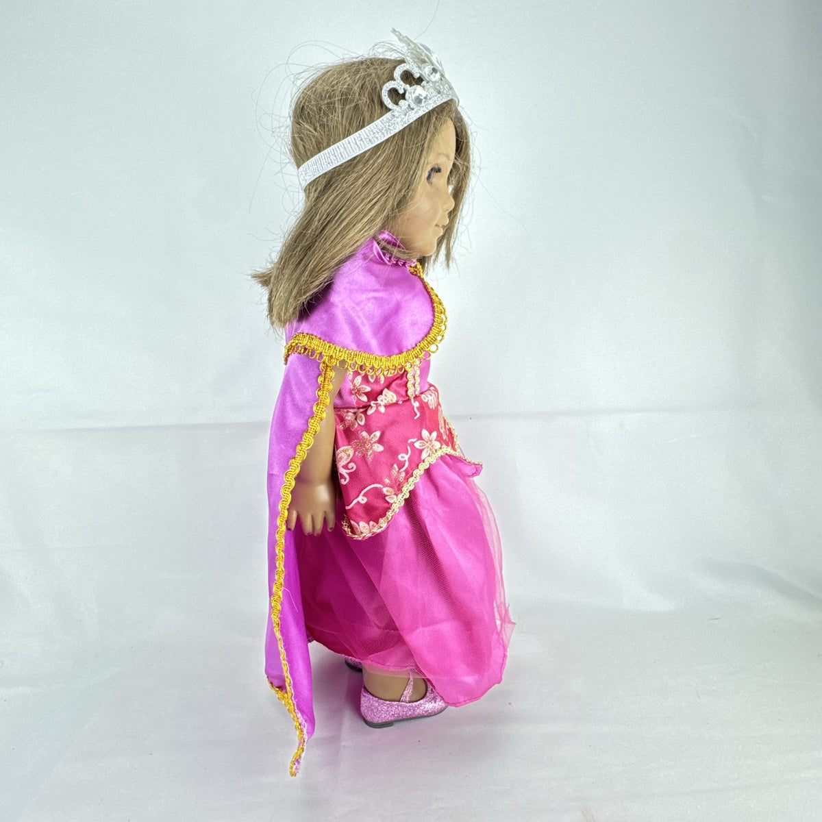 18-inch Pleasant Company American Girl doll with brown hair and brown eyes wearing pink and gold princess outfit