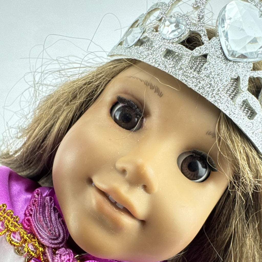 18-inch Pleasant Company American Girl doll with brown hair and brown eyes wearing pink and gold princess outfit