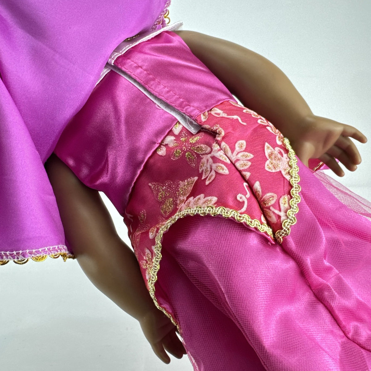 18-inch Pleasant Company American Girl doll with brown hair and brown eyes wearing pink and gold princess outfit