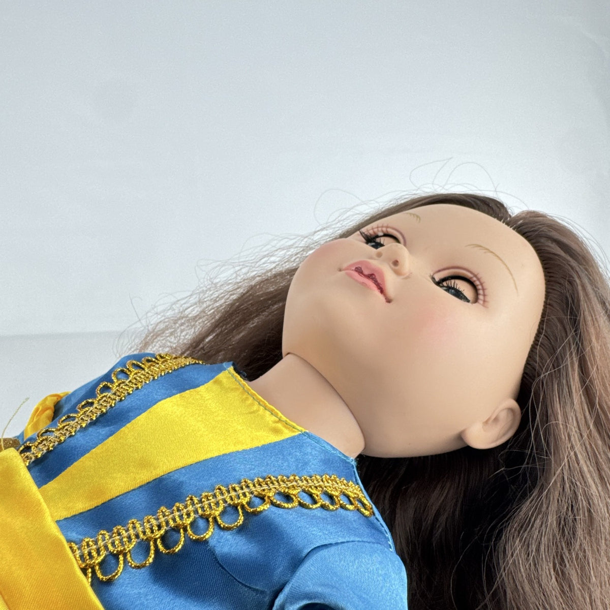 Cititoy 18-inch girl doll with wavy brown hair, blue highlight streak, and royal blue princess gown.