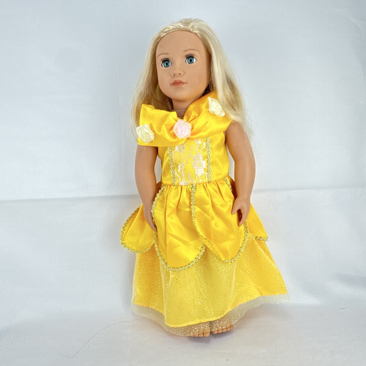 Our Generation 18-inch blonde doll with blue eyes wearing a yellow princess ballgown