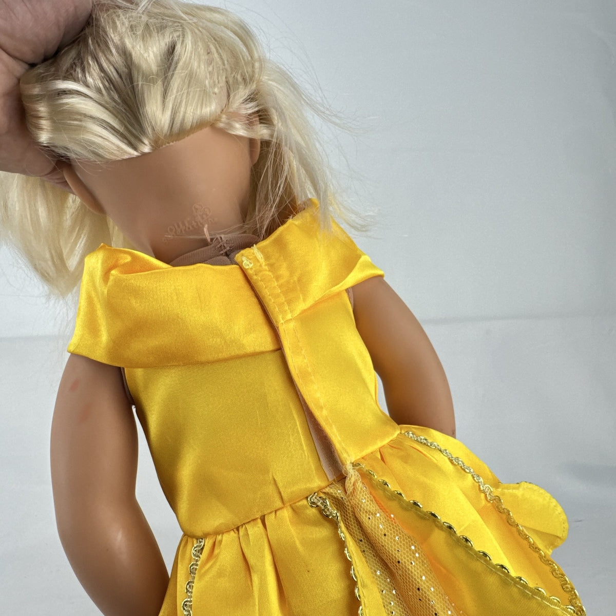 Our Generation 18-inch blonde doll with blue eyes wearing a yellow princess ballgown