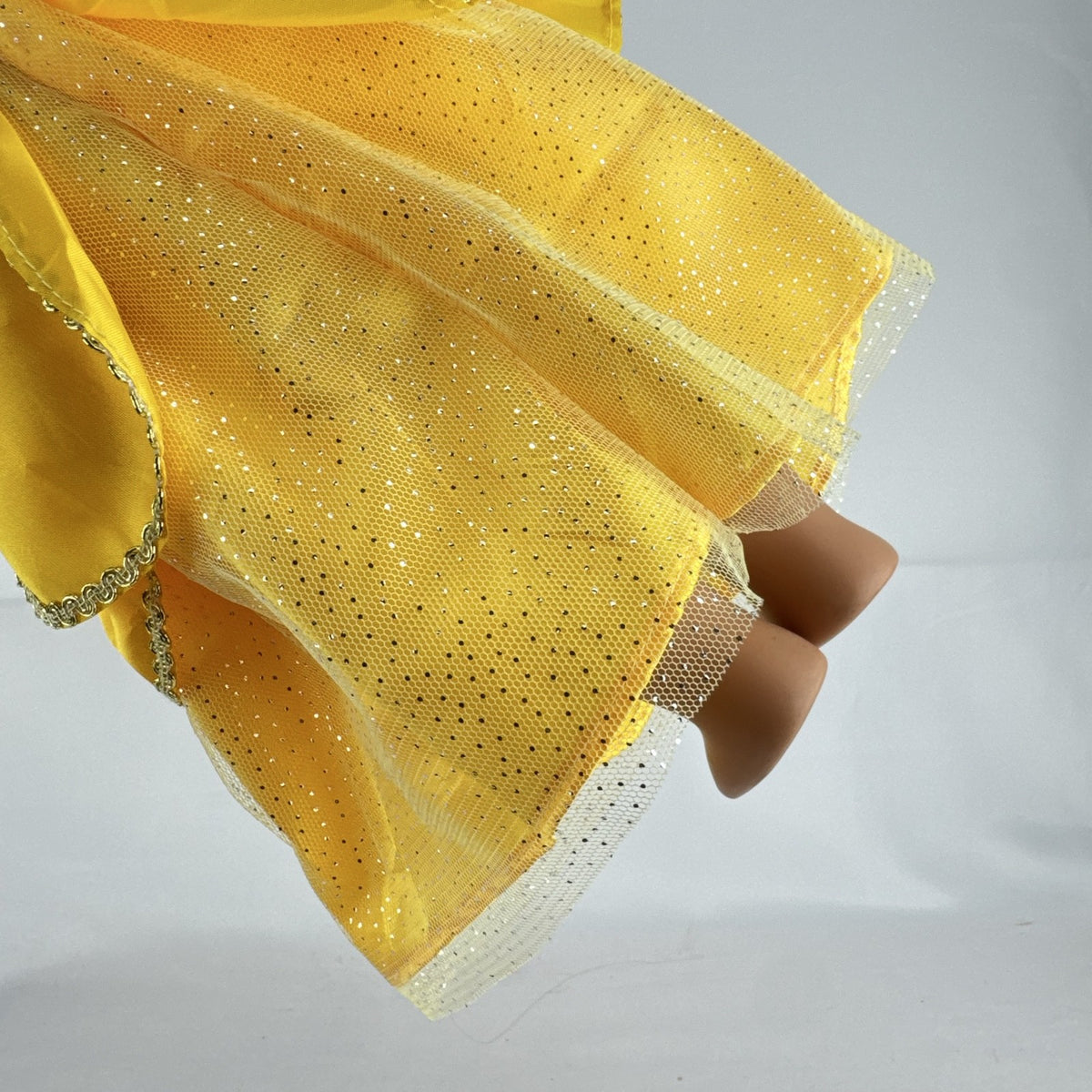 Our Generation 18-inch blonde doll with blue eyes wearing a yellow princess ballgown