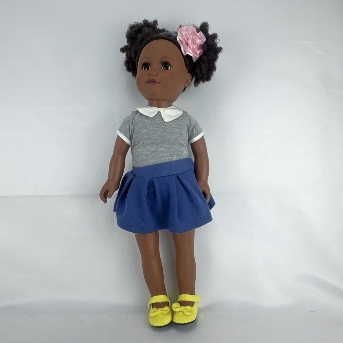 Cititoy 18-inch vinyl African American girl doll wearing grey shirt, blue skirt, and yellow shoes