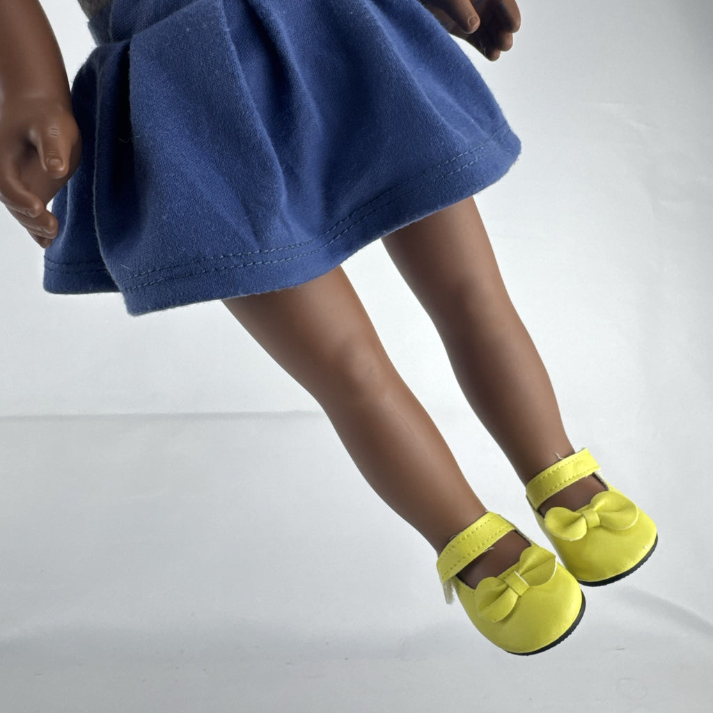 Cititoy 18-inch vinyl African American girl doll wearing grey shirt, blue skirt, and yellow shoes
